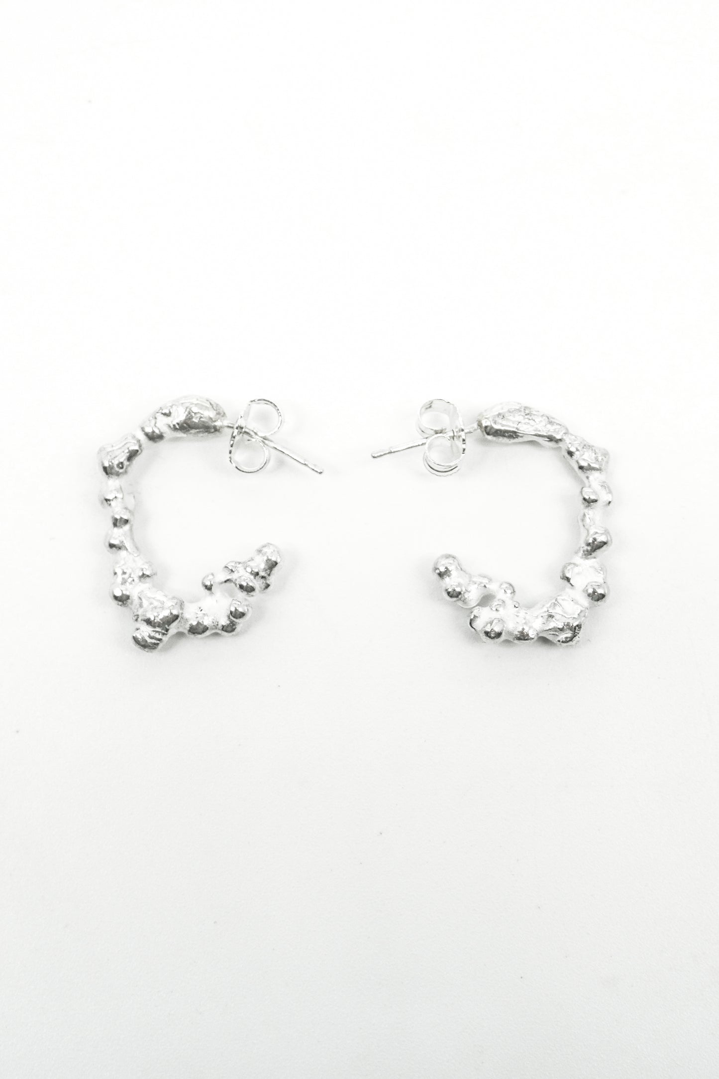 MELTED 1.0 LOOP EARRINGS in Silver